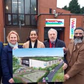 Killingbeck, Seacroft and Gipton and Harehills ward members holding an image of the proposed redevelopment during a visit to the leisure centre.  