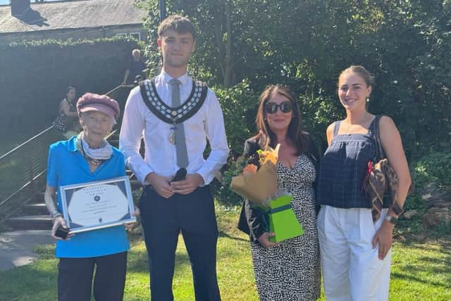 Kazia (left) with her 'Platinum Award' from Wetherby Town Council at the opening of Sandringham Park play area.
