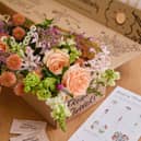 The blooms are carefully wrapped and boxed for delivery.