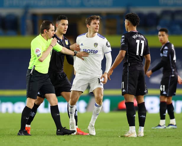 LONG HISTORY: Peter Bankes of Leeds United games in charge, the referee pictured separating Diego Llorente and Ollie Watkins in the Premier League clash at home to Aston Villa of February 2021.