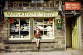 The little girl perched on the window sill enjoying an ice lolly is Vanessa Sharp.