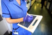 A nurse uses a wireless electronic tablet to order medicines. NHS nurses in England are set to benefit from a major pay and career overhaul agreed with the RCN (Photo: Christopher Furlong/Getty Images)