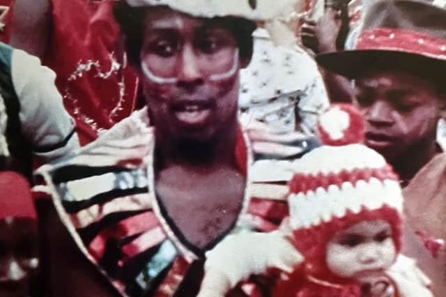 Eight-month-old Mahalia with her father at the Carnival.