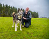 Kevin Johnson, Dog Welfare Assistant at Leeds Dogs Trust, with Teddy, a 13-year-old Akita.