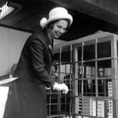 Marjorie Ziff, wife of the chairman of Town Centre securities Ltd, pictured in May 1964 opening a case with a golden key, containing a cake modelled on the shopping centre.