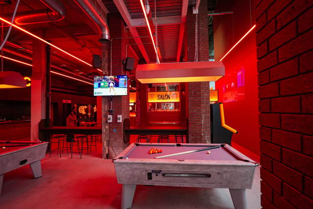 Pool tables at the back of the bar.