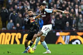 VALUABLE: View of Leeds United's point at Aston Villa from Whites right back Jayden Bogle, left, pictured battling it out with Tyrone Mings.