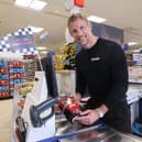 F1 World Champion Jenson Button took on shop assistants in a high-octane ‘Scan Grand Prix’.