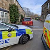 A cordon on Iron Row as police comb the street for evidence.