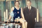 Doris with her trophies and pictured with the York Road Baths manager.