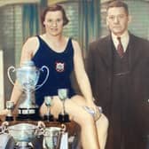 Doris with her trophies and pictured with the York Road Baths manager.