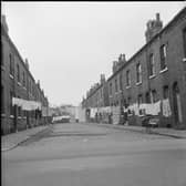 Washing hanging between back-to-back houses in Burmantofts, Leeds, during the late 60s or early 70s