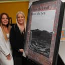 Becky and Shelley Joyce, Co-Founders of Homeless Street Angels, with the  signed Damien Hirst poster up for auction at their art exhibition and auction on March 14.