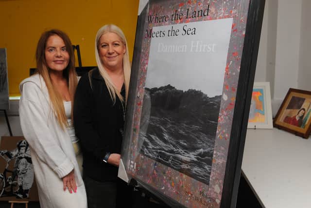 Becky and Shelley Joyce, Co-Founders of Homeless Street Angels, with the  signed Damien Hirst poster up for auction at their art exhibition and auction on March 14.