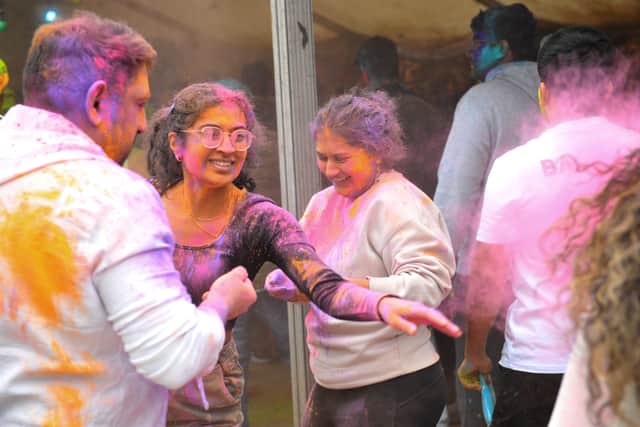 Powder and unity: Holi celebrations, which helped shape the vibrant powder-throwing of modern West Indian Carnival.