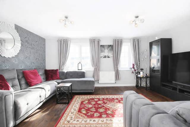 Bright and welcoming, the lounge provides a comfortable space to relax at the heart of the home on the first floor