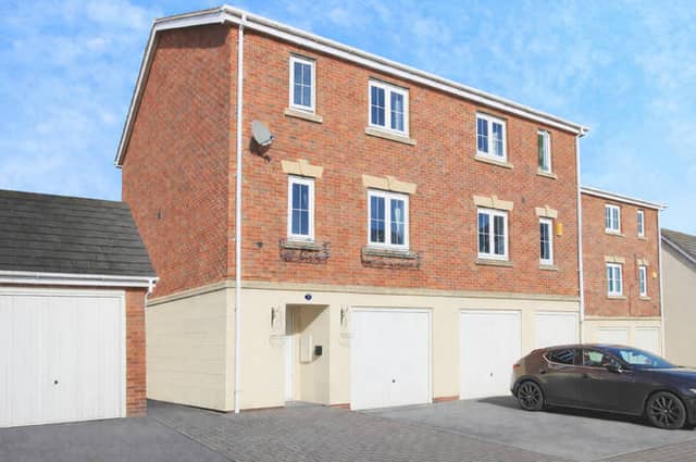 This modern townhouse in New Forest Village offers smart kerb appeal with driveway parking, EV charging and an integral garage