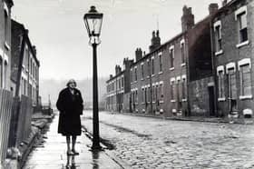 Ethel Kay, the street's last resident, stands on Cardigan Grove, Burley, Leeds, before it was demolished in 1970