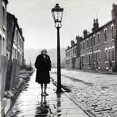 Ethel Kay, the street's last resident, stands on Cardigan Grove, Burley, Leeds, before it was demolished in 1970