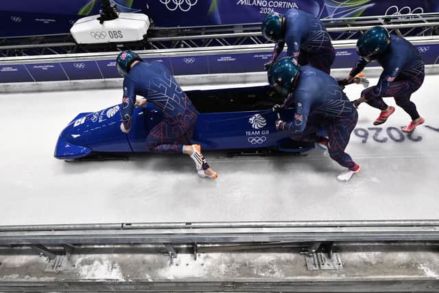 SPEED: Provided by Leon Greenwood as Brad Hall, Greg Cackett and Taylor Lawrence compete in the bobsleigh men's 4-man heat 1 at Cortina Sliding Centre during the Milano Cortina 2026 Winter Olympic Games. 
Photo by Tiziana FABI / AFP via Getty Images.