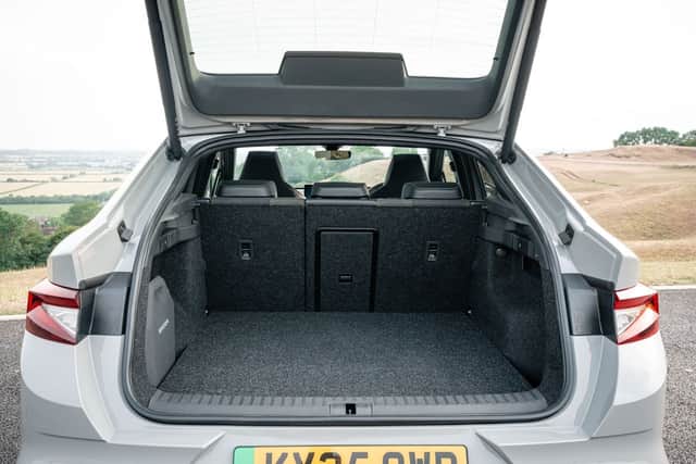 There's plenty of room in the cabin, despite the coupe roof line