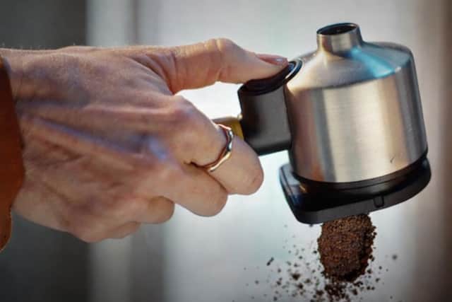 A puck of coffee drops out of the filter and you're ready for another brew