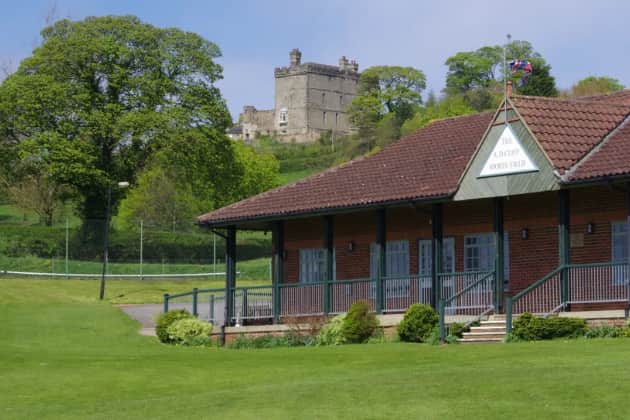 Explore the historic 'village on the hill' and its famous field of gold