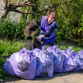  Sandra McLean, coordinator of Litter Free Leeds, with a collection of purple bags filled with rubbish collected on wasteland in Meanwood.