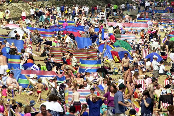 North Bay beach at midday on a Sunday afternoon in July 2001 with barely a space to be found.