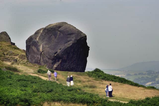 Ilkley Moor opened to public in August 2001 after the foot and mouth crisis. Pictured are members of the public walking near the Cow and Calf Rocks.