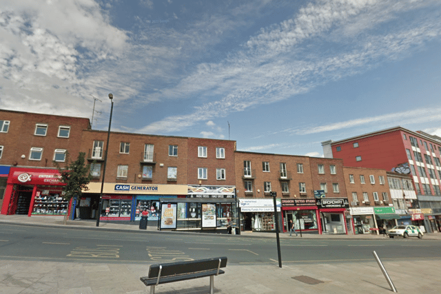 The man climbed onto the roof above Cash Generator on The Springs in Wakefield.