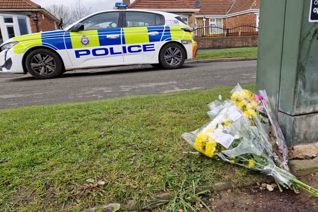 Flowers laid in Kennerleigh Avenue, Austhorpe, following the death of a 16-year-old girl