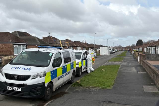 Police forensics officers at the scene in Kennerleigh Avenue