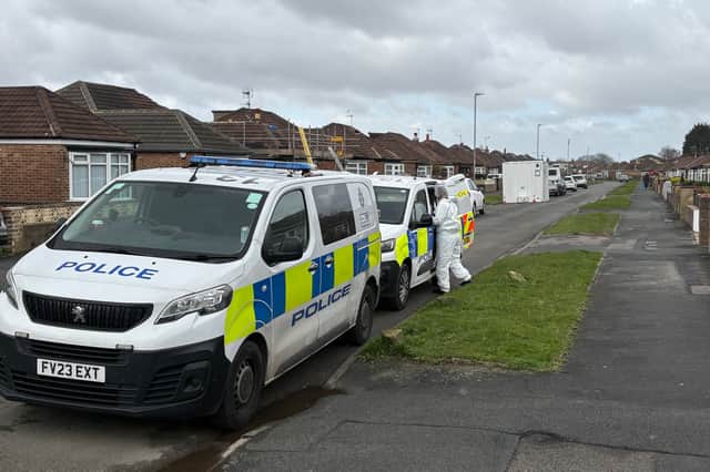 Police forensics officers at the scene in Kennerleigh Avenue