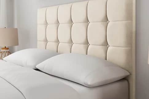 The Simba Hoxton bed in oyster white shows off its soft velvet finish and full-height cushioned headboard