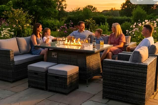 A spacious rattan garden dining set with built-in firepit creates the perfect setting for summer evenings outdoors