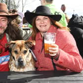 Nick and Louise Thatcher and Olga the dog enjoy a drink at the festival