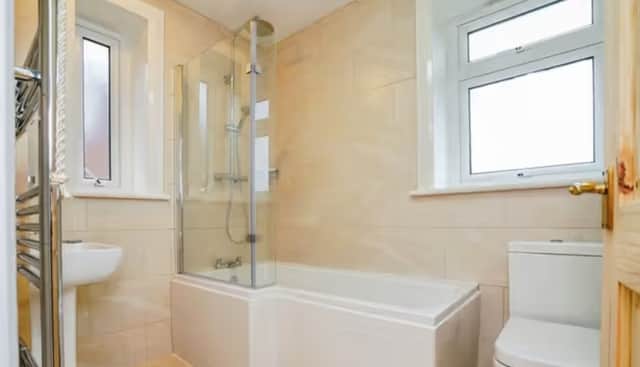 The bathroom of a three-bedroom semi-detached house that is for sale on Woodnook Drive, Cookridge, Leeds.