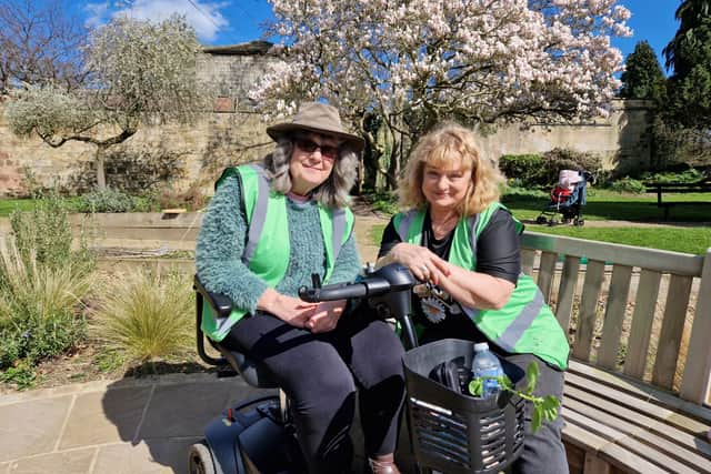 Sue Bray and Janet Galvin at the community garden.