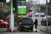 A customer fills up his car at a petrol service station in West Yorkshire. Petrol prices in Leeds are rising again as global oil markets surge (Photo: Oli SCARFF / AFP via Getty Images)