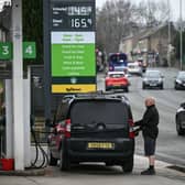 A customer fills up his car at a petrol service station in West Yorkshire. Petrol prices in Leeds are rising again as global oil markets surge (Photo: Oli SCARFF / AFP via Getty Images)