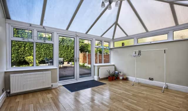 The conservatory of a four bedroom detached house that is for sale on Adel Park Close, Leeds.