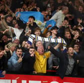 Leeds United fans celebrate during win at Man Utd.