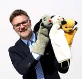 TV auctioneer Charles Hanson with three of the most famous glove puppets in the world.  They have been consigned for sale by his son Dave Corbett who, with his brother Matthew, was the inspiration behind the global phenomenon.