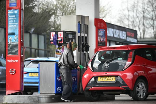 A customer fills up her car at a petrol service station in West Yorkshire. Petrol prices have surged, with a typical fill-up up by £14 (Photo: Oli SCARFF / AFP via Getty Images)