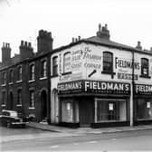  Fieldman's fashion corner and ladies hair stylist on Hunslet Road in November 1960.  On the left is Newport Street. On the right is Alton Street.