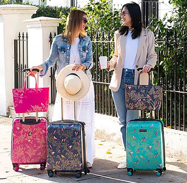 These new colourful pink, blue and green suitcases from Sara Miller London are standout luggage - and they fit within Ryanair size requirements.