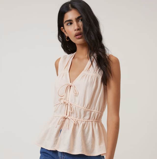 Nobody's Child Linen-rich ruched tie-front peplum top.