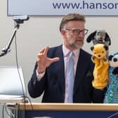 TV auctioneer Charles Hanson had his hands full with three of the most famous glove puppets in the world, owned by the legendary puppeteer Harry Corbett.  