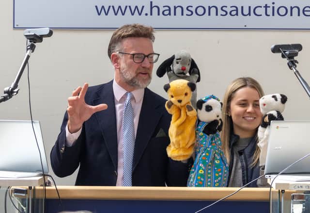 TV auctioneer Charles Hanson had his hands full with three of the most famous glove puppets in the world, owned by the legendary puppeteer Harry Corbett.  
